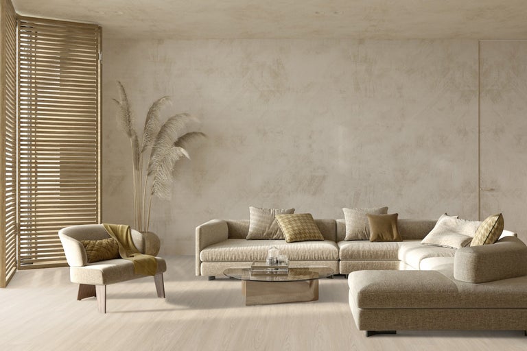 Cameră de zi cu canapea de colț, fotoliu, măsuță de cafea și jaluzele din lemn