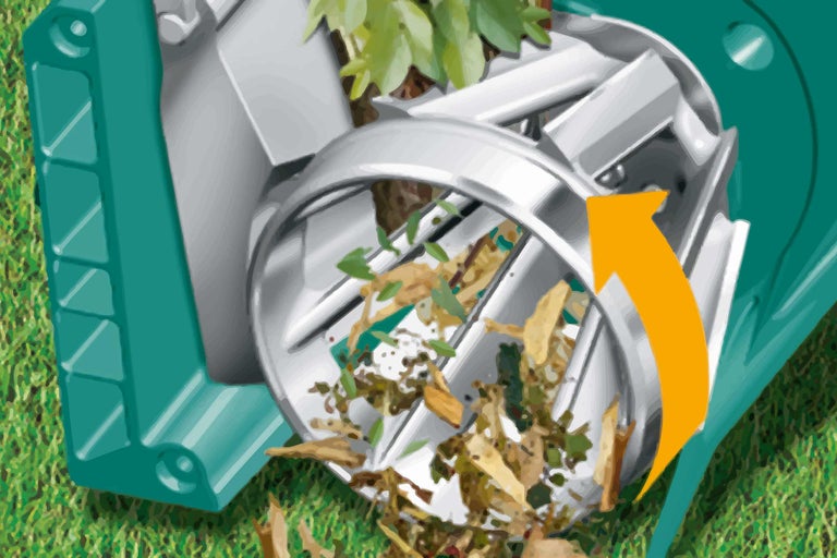 Aparat de grădină pentru mărunțirea deșeurilor de grădină cu pâlnie de umplere și săgeată galbenă