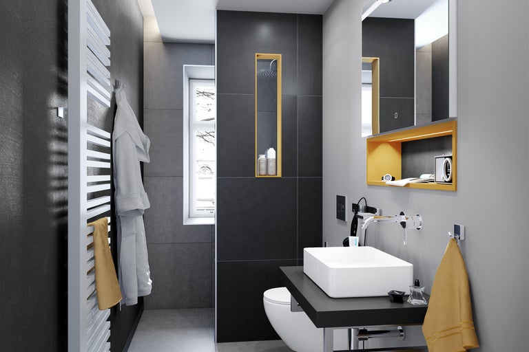 Baie modernă cu lavoar, toaletă, calorifer pentru prosoape și oglindă