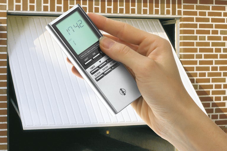 Mână cu telecomandă radio pentru ușa de garaj