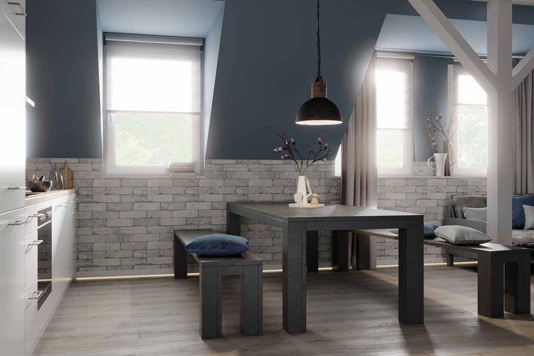 Zonă de luat masa cu masă, bănci și lampă suspendată într-o cameră luminoasă