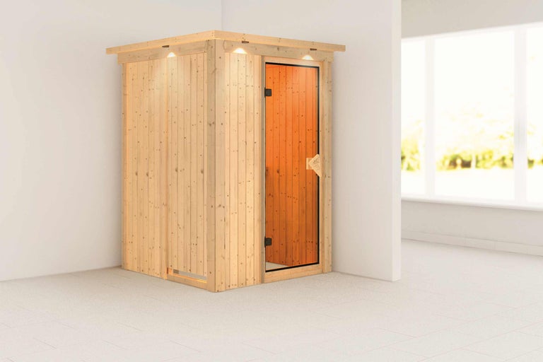 Saună din lemn cu ușă de sticlă într-o cameră luminoasă