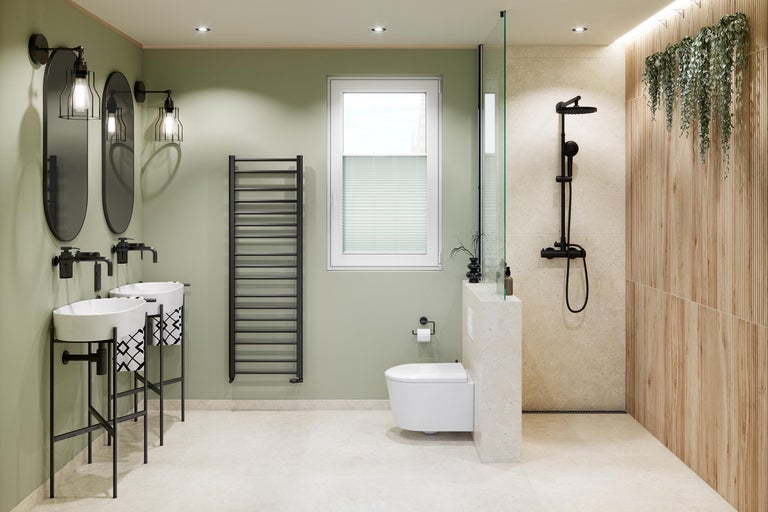 Baie modernă cu două lavoare, oglinzi ovale, radiator negru, vas toaletă suspendat și duș cu panouri de perete cu aspect de lemn.