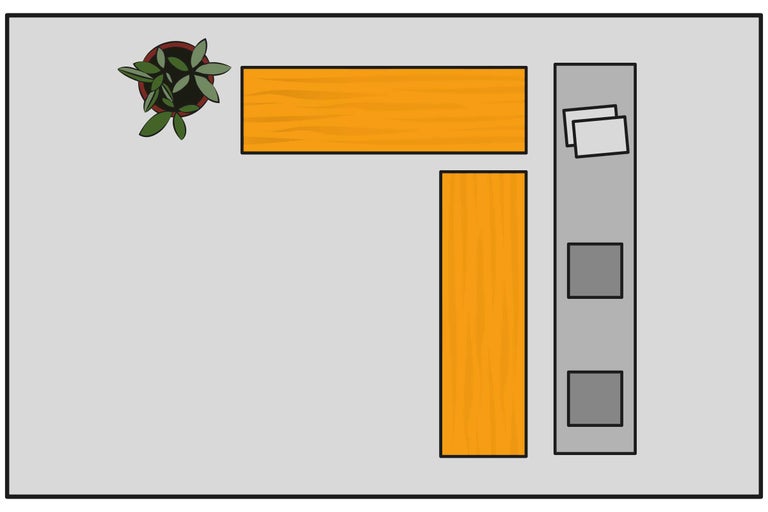 Vedere de sus a unui birou de colț cu plantă, blaturi de birou și container mobil