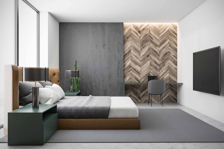 Dormitor cu pat, birou și televizor pe perete