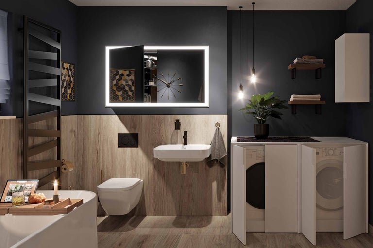 Baie modernă cu lavoar, toaletă, oglindă iluminată și mașină de spălat