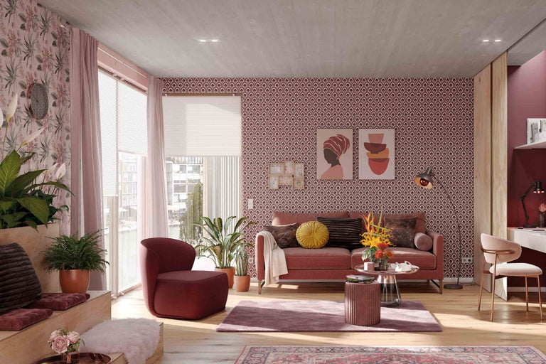 Living cu canapea, fotoliu, plante de interior și decorare decorativă a pereților pentru o ambianță elegantă.