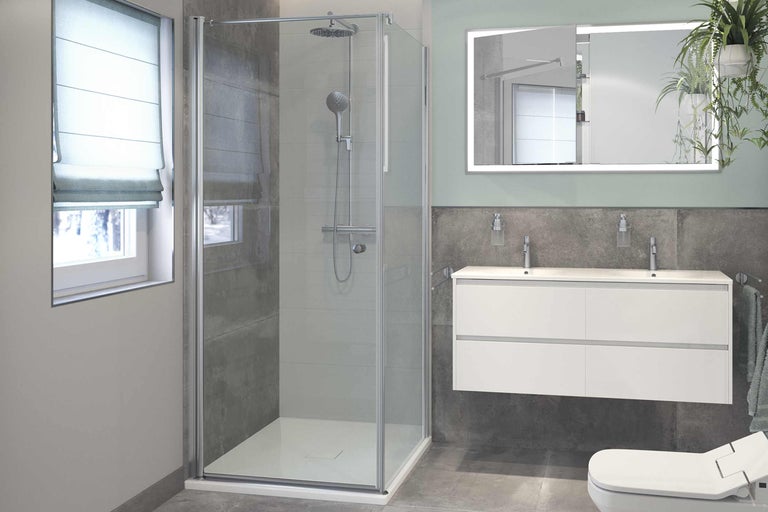 Baie modernă cu cabină de duș, chiuvetă și oglindă iluminată