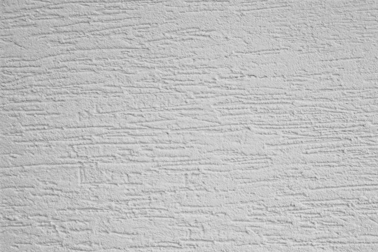 Prim-plan cu un perete cu structură de tencuială zgâriată