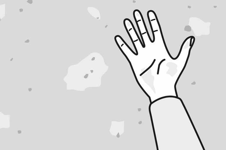 Ilustrație a unei mâini în fața unui perete cu deteriorări