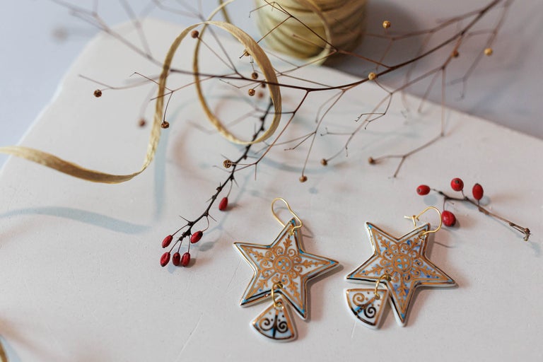 Cercei în formă de stea cu decor ornamentat