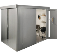 Magazie metalică de grădină cu ușa deschisă și grătar în interior