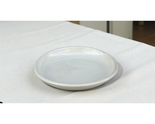 Farfurie ceramică pe material textil