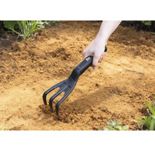 Cultivator de grădină folosit în pământ