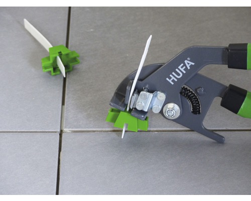 Sistem de nivelare a plăcilor cu clește pentru montarea plăcilor