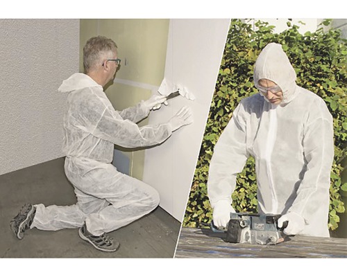 Doi meșteri în costume de protecție care efectuează lucrări de renovare