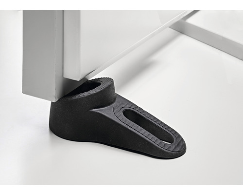 Oprire de ușă neagră din cauciuc sub o ușă