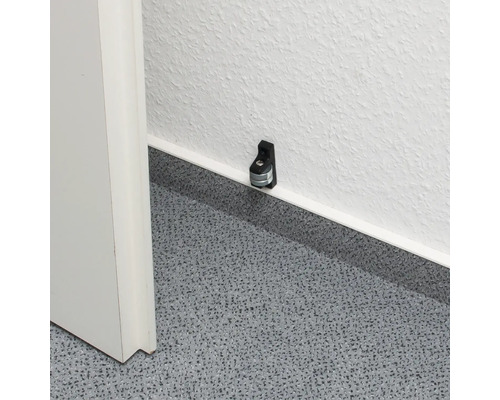 Opritor de ușă de perete pe un perete lângă o ușă