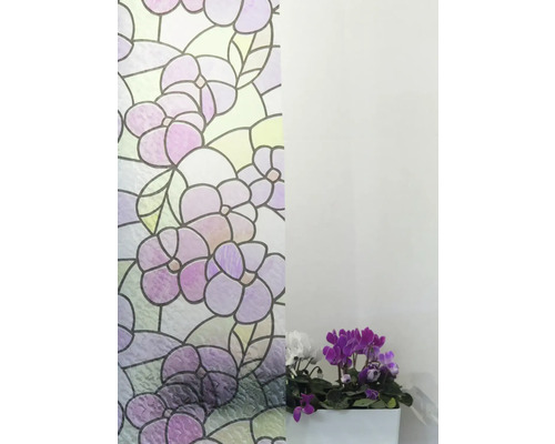 Folie decorativă cu model floral lângă o plantă la ghiveci