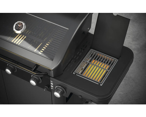 Imagine detaliată cu un grătar pe gaz negru, cu arzător lateral și indicator de temperatură.