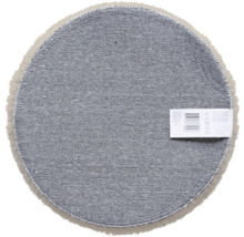 Partea inferioară a covorului rotund cu etichetă