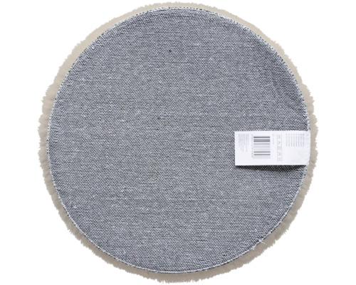 Partea inferioară a covorului rotund cu etichetă