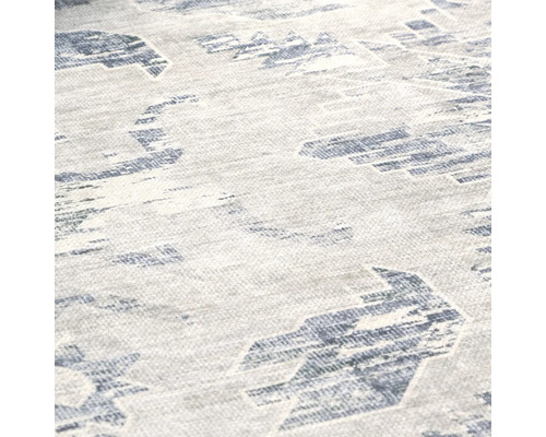 Imagine detaliată a unui covor cu modele geometrice