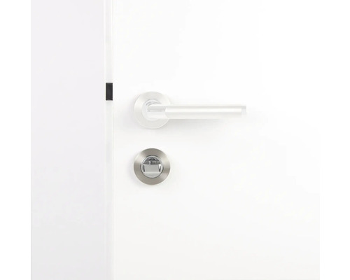 Feronerie ușă cu buton rotativ pe o ușă albă