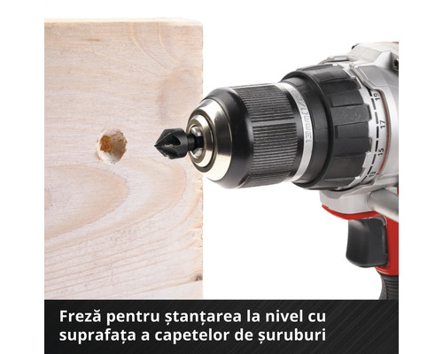 Burghiu cu freză de teşire în fața unui bloc de lemn