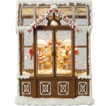 Glob decorativ cu zăpadă în formă de casă de turtă dulce cu oameni de turtă dulce