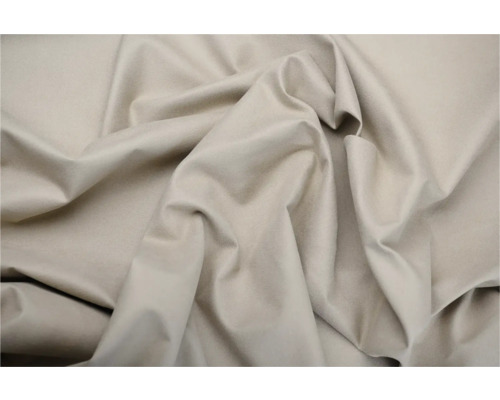 Prim-plan cu o țesătură bej cu pliuri