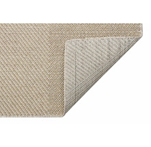 Covor cu colțul îndoit pentru a arăta partea inferioară