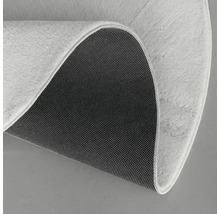 Detaliu covor rotund cu fibre și spate antiderapant