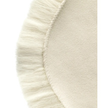 Prim-plan al unui covor rotund cu franjuri decorative