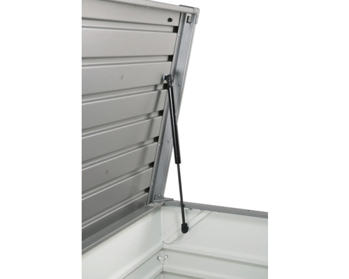 Detaliu al unei magazii de scule deschise cu arc pe gaz care susține capacul