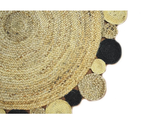 Imagine detaliată a unui covor rotund din iută cu bordură decorativă