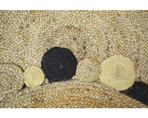 Detaliu al unui covor rotund din iută cu decorațiuni rotunde aplicate