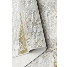 Prim-plan cu un covor deschis la culoare cu model abstract