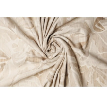 Prim-plan cu o țesătură decorativă bej cu model