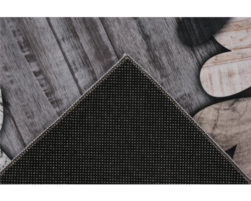 Detaliu al unui covor cu model de piatră pe aspect de lemn