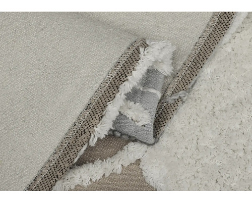 Imagine detaliată a unui covor cu franjuri