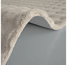 Imagine detaliată a unui covor gri cu fibre