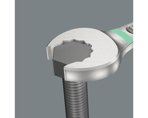 O cheie fixă prinde un șurub.