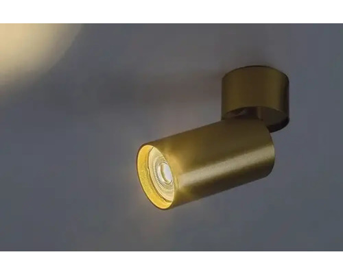 Lumină de plafon aurie cu o rază de lumină