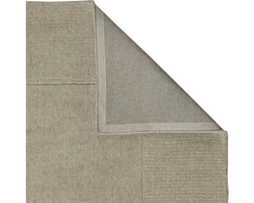 Vedere detaliată a unui covor bej care arată textura și construcția