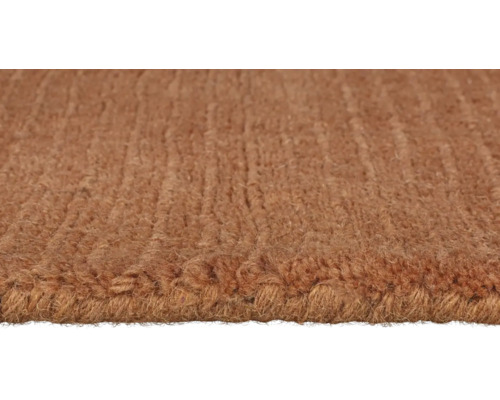 Prim-plan cu un covor maro texturat