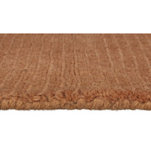 Prim-plan cu un covor maro cu textură densă