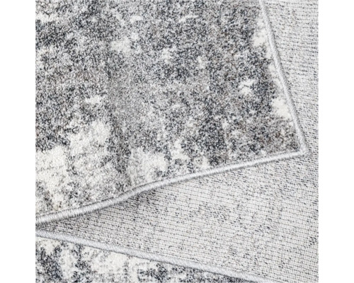 Prim-plan al unui covor gri cu model abstract