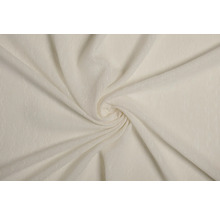 Prim-plan cu o țesătură bej cu un model spiralat.