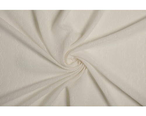 Prim-plan cu o țesătură bej cu un model spiralat.